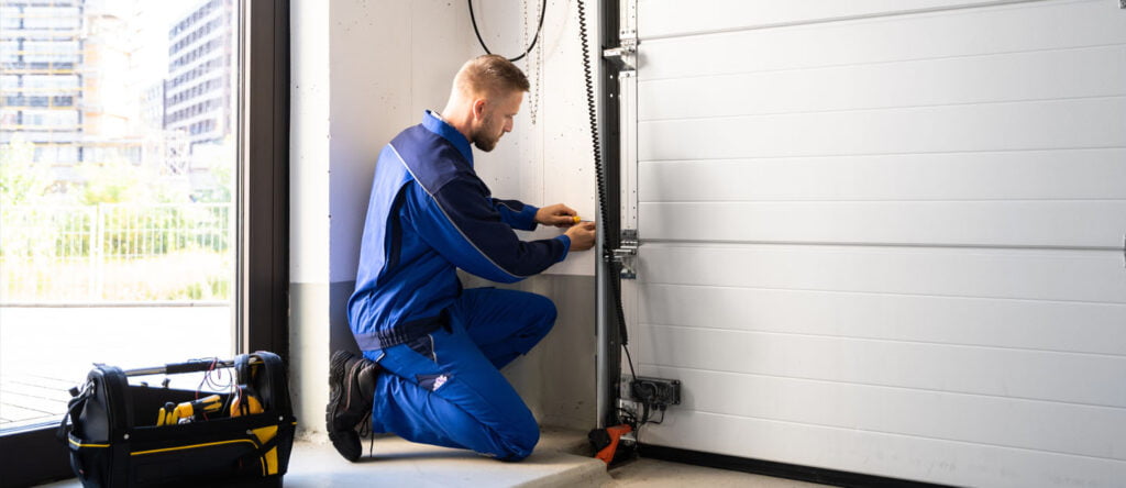 technician inspecting the garage door